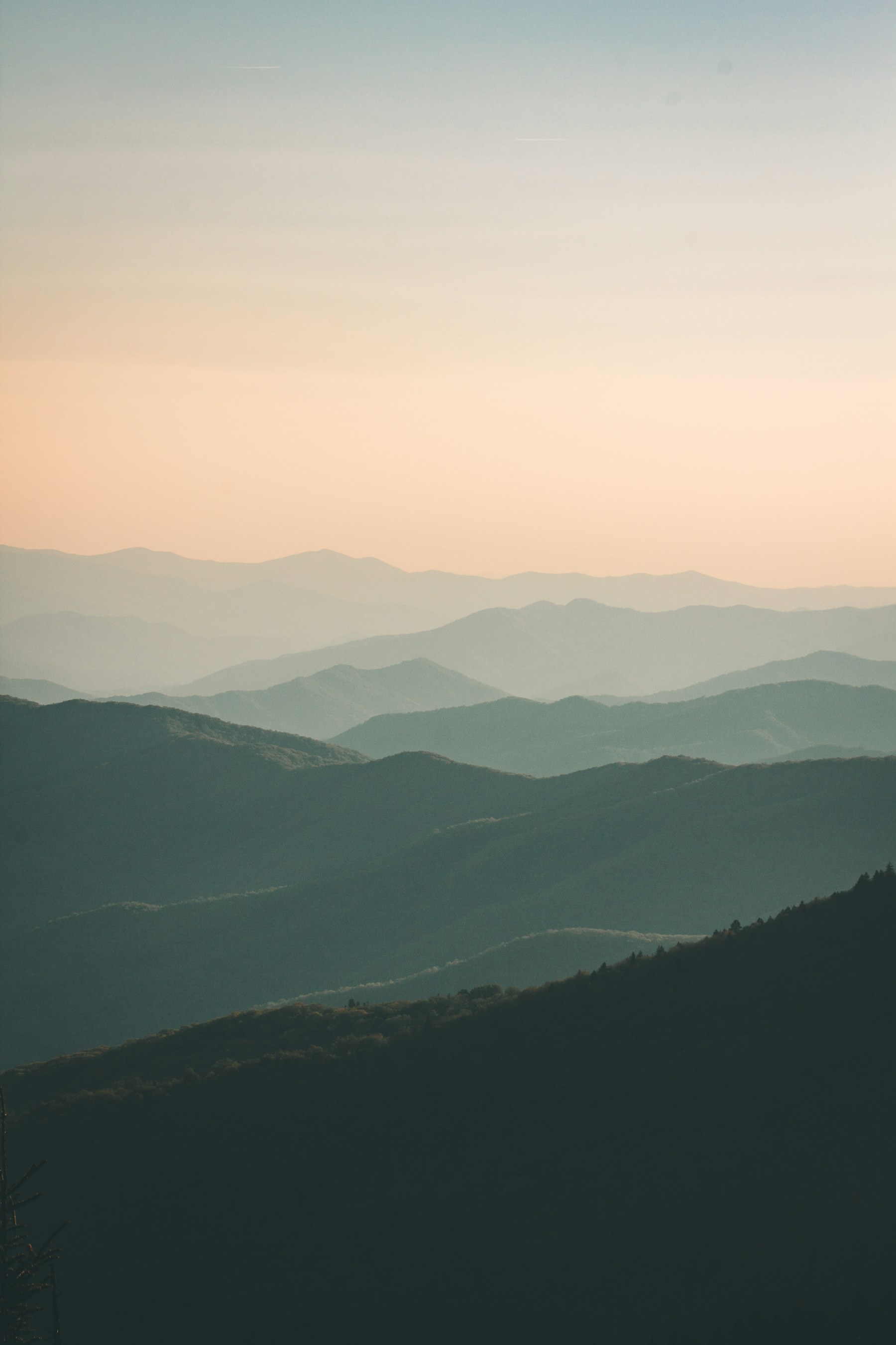 Layered mountain ridges in warm evening light